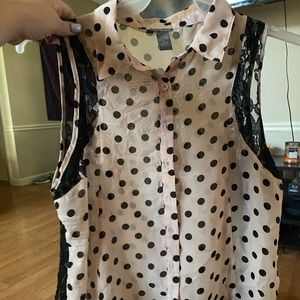 Sleeveless polka dotted blouse